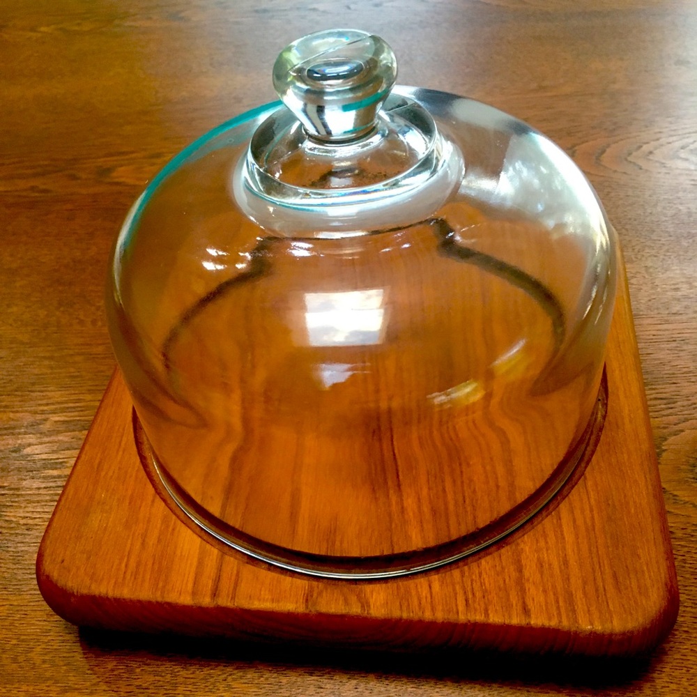 Teakwood Cheese Dome. Very heavy glass top, grooved channel. Footed.Never used.